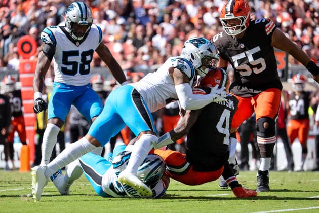 CLEVELAND, OH - SEPTEMBER 27: Cleveland Browns quarterback Deshaun Watson (4) is sacked by Carolina Panthers linebacker Princely Umanmielen (3) and Carolina Panthers safety Tre von Moehrig (7) assists during the third quarter of the National Football League game between the Carolina Panthers and Cleveland Browns on September 27, 2026, at Huntington Bank Field in Cleveland, OH. (Photo by Frank Jansky Icon Sportswire) NFL, American Football Herren, USA SEP 27 Panthers at Browns EDITORIAL USE ONLY Icon260927029