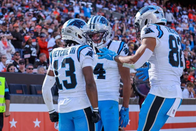 CLEVELAND, OH - SEPTEMBER 27: Carolina Panthers wide receiver John Metchie III (13) celebrates with Carolina Panthers wide receiver Tetairoa McMillan (4) and Carolina Panthers tight end Tommy Tremble (82) after scoring on a 8-yard touchdown pass during the fourth quarter of the National Football League game between the Carolina Panthers and Cleveland Browns on September 27, 2026, at Huntington Bank Field in Cleveland, OH. (Photo by Frank Jansky Icon Sportswire) NFL, American Football Herren, USA SEP 27 Panthers at Browns EDITORIAL USE ONLY Icon260927033