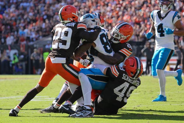 CLEVELAND, OH - SEPTEMBER 27: Carolina Panthers tight end Darren Waller (88) is gang tackled short of the line to gain on fourth down by Cleveland Browns cornerback Mekhi Blackmon (29), Cleveland Browns cornerback Myles Harden (26), and Cleveland Browns linebacker Carson Schwesinger (49) during the fourth quarter of the National Football League game between the Carolina Panthers and Cleveland Browns on September 27, 2026, at Huntington Bank Field in Cleveland, OH. (Photo by Frank Jansky Icon Sportswire) NFL, American Football Herren, USA SEP 27 Panthers at Browns EDITORIAL USE ONLY Icon260927040