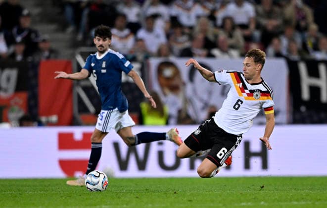 Joshua Kimmich GER 06 Action Thanasis Androutsos GRE 15 DFB International Match Germany GER vs. Greece GRE UEFA Nations League on September 27, 2026 DFL REGULATIONS PROHIBIT ANY USE OF PHOTOGRAPHS AS IMAGE SEQUENCES AND OR QUASI-VIDEO DFB International Match: Germany (GER) vs. Greece (GRE) – UEFA Nations League