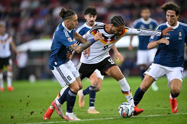Tackle, Action: Kevin Schade (GER 09) vs. Kostas Tsimikas (GRE 21) – DFB International Match: Germany (GER) vs. Greece (GRE) – UEFA Nations League on September 27, 2026. DFL regulations prohibit any use of photographs as image sequences and or quasi- VIDEO DFB international match: Germany (GER) vs. Greece (GRE), UEFA Nations League