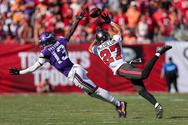 Sep 27, 2026; Tampa, FL, USA; Tampa Bay Buccaneers cornerback Zyon McCollum (27) attempts to intercept a pass intended for Minnesota Vikings wide receiver Tai Felton (13) during an NFL, American Football Herren, USA football game between the Minnesota Vikings and Tampa Bay Buccaneers at Raymond James Stadium in Tampa, Florida. Mandatory Credit: Taylor McFee-Cal Media Tampa USA - ZUMAc04_ 20260927_zma_c04_077 Copyright: xTaylorxMcfeex