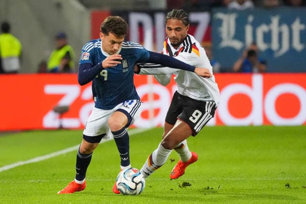 Kevin Schade (Germany) goes head-to-head with Konstantinos Karetsas (Greece) in Augsburg on September 27, 2026. Germany vs. Greece, UEFA Nations League, WWK Arena, Matchday 2