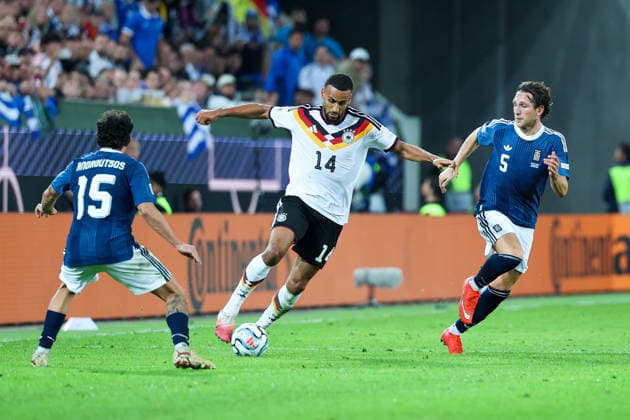 September 27, 2026, GER, Soccer, Men s, UEFA Nations League, League A, 2026–2027 Season, Matchday 2, Germany vs. Greece: Thanasis Androutsos (Greece, 15) on the left, Josha Vagnoman (Germany, 14) in the center, Panagiotis Retsos (Greece, 5) on the right. DFB and DFL regulations prohibit any use of photographs as image sequences and or quasi-video. Augsburg WWK Arena, Bavaria, Germany Copyright: xNordphoto Schneiderx