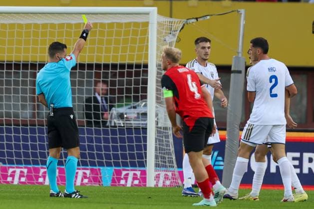 27.09.2026 - SOCCER - 2026 27 UEFA NATIONS LEAGUE, League B - Group B3, Round 2, Austria vs Kosovo The referee Nicholas Walsh SCO issues a yellow card Vienna Ernst-Happel-Stadion Vienna Austria Copyright: xYigitxOermexYigitxOermex