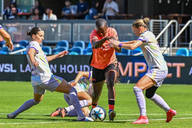 SAN JOSE, CA - SEPTEMBER 27: Bay FC forward Racheal Kundananji (9) squeezes between Orlando Pride defender Haley McCutcheon (2) and Orlando Pride midfielder Cori Dyke (12) for ball control during the Latino Heritage match between Orlando Pride and Bay FC on Sunday, September 27, 2026 at PayPal Stadium in San Jose, California. (Photo by Douglas Stringer Icon Sportswire) SOCCER: SEP 27 NWSL Bay FC vs Orlando Pride EDITORIAL USE ONLY Icon26092710
