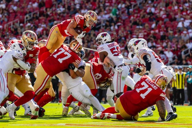 SANTA CLARA, CA - SEPTEMBER 27: Christian McCaffrey 23 of the San Francisco 49ers jumps for a touchdown in the third quarter of an NFL, American Football Herren, USA game against the Arizona Cardinals on September 27, 2026 at Levi s Stadium in Santa Clara, CA. (Photo by Matthew Huang Icon Sportswire) NFL: SEP 27 Cardinals at 49ers EDITORIAL USE ONLY Icon260927023