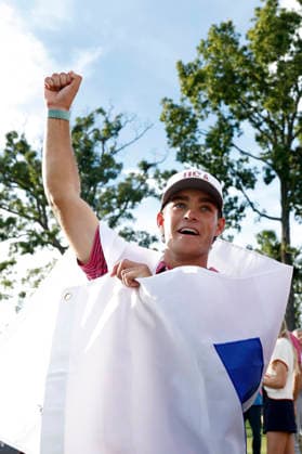 MEDINAH, IL - SEPTEMBER 27: Jackson Koivun of the United States wears a ÒWÓ flag as he celebrate on the No. 18 green following Team USAÕs win at the Presidents Cup, September 27, 2026, at Medinah Country Club in Medinah, Illinois. (Photo by Matthew Maxey Icon Sportswire) GOLF: SEP 27 Presidents Cup EDITORIAL USE ONLY Icon260927051