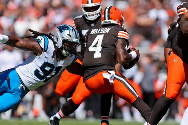CLEVELAND, OH - SEPTEMBER 27: Cleveland Browns quarterback Deshaun Watson (4) eludes the rush of Carolina Panthers linebacker Patrick Jones II (91) during the first quarter of the National Football League game between the Carolina Panthers and Cleveland Browns on September 27, 2026, at Huntington Bank Field in Cleveland, OH. (Photo by Frank Jansky Icon Sportswire) NFL, American Football Herren, USA SEP 27 Panthers at Browns EDITORIAL USE ONLY Icon260927046