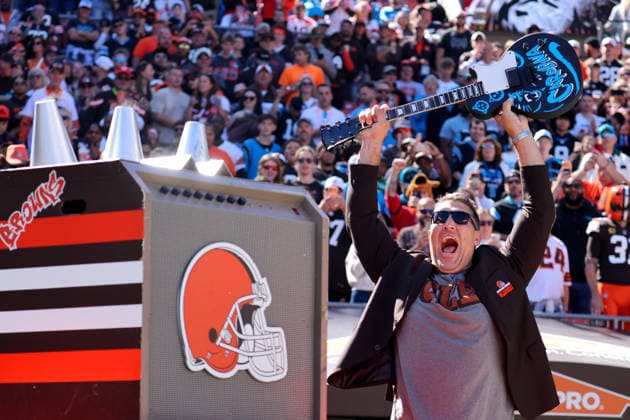 CLEVELAND, OH - SEPTEMBER 27: Former Browns center Alex Mack smashes a Panthers-themed guitar prior to the National Football League game between the Carolina Panthers and Cleveland Browns on September 27, 2026, at Huntington Bank Field in Cleveland, OH. (Photo by Frank Jansky Icon Sportswire) NFL, American Football Herren, USA SEP 27 Panthers at Browns EDITORIAL USE ONLY Icon260927049