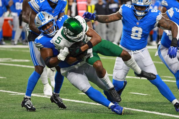New York Jets vs Detroit Lions DETROIT,MICHIGAN-SEPTEMBER 27: Wide receiver Garrett Wilson 5 of the New York Jets is tackled by defensive tackle Alim McNeill 54 of the Detroit Lions during the first half of an NFL, American Football Herren, USA football game between the New York Jets and the Detroit Lions in Detroit, Michigan USA, on Sunday, September 27, 2026 Detroit Michigan United States  Copyright: xJorgexLemusx originalFilename:lemus-newyorkj260927_npaAH.jpg