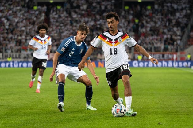 GER, Bavaria, Augsburg, Soccer, Germany vs. Greece, at the WWK Arena, Augsburg, UEFA Nations League, Matchday 2, Group Stage, September 27, 2026, From left: Giorgos Vagiannidis (Greece), 2; Nathaniel Brown (Germany), 18; in attack; tackle. DFL and DFB regulations prohibit any use of photographs as image sequences and or quasi-video, Copyright: HMB-Media MichaelxNibel