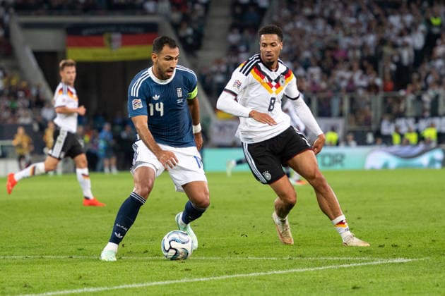 GER, Bavaria, Augsburg, Soccer, Germany vs. Greece, at the WWK Arena, Augsburg, UEFA Nations League, Matchday 2, Group Stage, September 27, 2026, from left: Vangelis Pavlidis (Greece), 14, Felix Nmecha (Germany), 8, in a tackle. DFL and DFB regulations prohibit any use of photographs as image sequences and or quasi-video, Copyright: HMB-Media MichaelxNibel