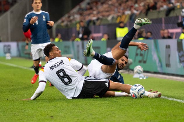 GER, Bavaria, Augsburg, Soccer, Germany vs. Greece, at the WWK Arena, Augsburg, UEFA Nations League, Matchday 2, Group Stage, September 27, 2026, from left: Vangelis Pavlidis (Greece), 14, Felix Nmecha (Germany), 8, in a tackle; DFL and DFB regulations prohibit any use of photographs as image sequences and or quasi-video, Copyright: HMB-Media MichaelxNibel