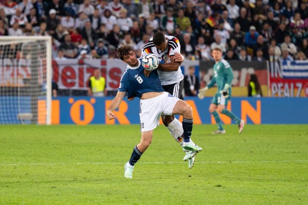 GER, Bavaria, Augsburg, Soccer, Germany vs. Greece, at the WWK Arena, Augsburg, UEFA Nations League, Matchday 2, Group Stage, September 27, 2026, From left: Fotis Ioannidis (Greece), 8, Jonathan Tah (Germany), 4, header duel, tackle. DFL and DFB regulations prohibit any use of photographs as image sequences and or quasi-video, Copyright: HMB-Media MichaelxNibel