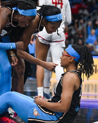 ATLANTA, GA - SEPTEMBER 27: Atlanta guard Rhyne Howard (10) and forward Angel Reese (5) congratulate teammate Allisha Gray (15) during the WNBA, Basketball Damen, USA first round playoff game between the Washington Mystics and the Atlanta Dream on September 27th, 2026 at State Farm Arena in Atlanta, GA. (Photo by Rich von Biberstein Icon Sportswire) WNBA: SEP 27 Playoffs Washington Mystics at Atlanta Dream EDITORIAL USE ONLY Icon260927042