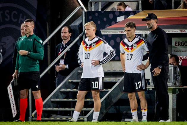 Augsburg, Germany, September 27, 2026 Jonathan Burkardt (GER) Florian Wirtz (GER) Coach Jürgen Klopp (GER) Germany Greece Germany Greece September 27, 2026