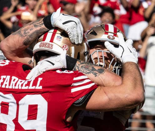 San Francisco 49ers tight end George Kittle (85) celebrates with tight end Luke Farrell (89) after a 10 yard touchdown pass from Brock Purdy in the fourth quarter against the Arizona Cardinals at Levi s Stadium in Santa Clara, California on Sunday, September 27, 2026. The 49ers defeated the Cardinals 36 to 30.  SXP2026092718 TerryxSchmitt