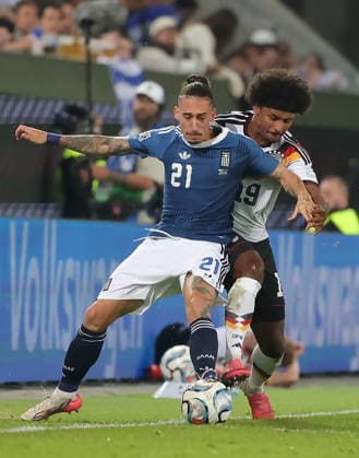 (260928) -- AUGSBURG, Sept. 28, 2026 -- Karim Adeyem (R) of Germany vies with Kostas Tsimikas of Greece during the UEFA Nations League 2026 27 League A Group A match between Germany and Greece in Augsburg, Germany, Sept. 27, 2026. (Photo by Xinhua) (SP)GERMANY-AUGSBURG-UEFA NATIONS LEAGUE-LEAGUE A-GERMANY VS GREECE PhilippexRuiz 