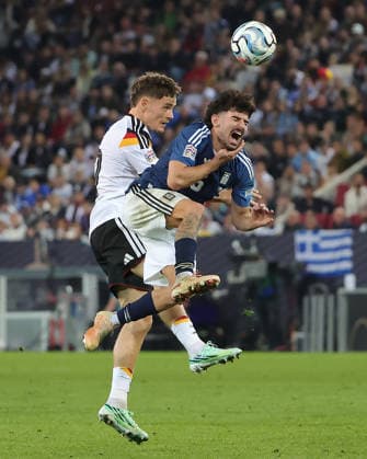 (260928) -- AUGSBURG, Sept. 28, 2026 -- Florian Wirtz (back) of Germany and Thanasis Androutsos of Greece head for the ball during the UEFA Nations League 2026 27 League A Group A match between Germany and Greece in Augsburg, Germany, Sept. 27, 2026. (Photo by Xinhua) (SP)GERMANY-AUGSBURG-UEFA NATIONS LEAGUE-LEAGUE A-GERMANY VS GREECE PhilippexRuiz 