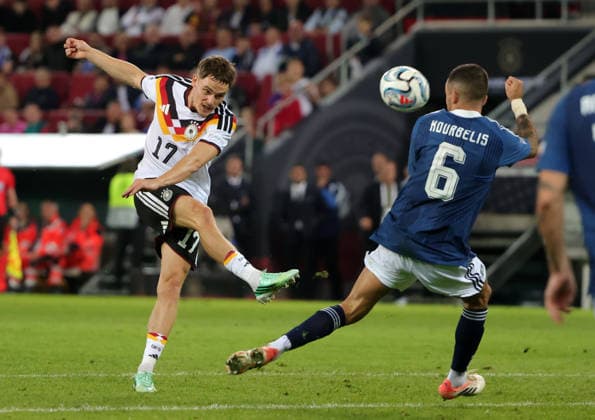 (260928) -- AUGSBURG, Sept. 28, 2026 -- Florian Wirtz (L) of Germany vies with Dimitris Kourbelis of Greece during the UEFA Nations League 2026 27 League A Group A match between Germany and Greece in Augsburg, Germany, Sept. 27, 2026. (Photo by Xinhua) (SP)GERMANY-AUGSBURG-UEFA NATIONS LEAGUE-LEAGUE A-GERMANY VS GREECE PhilippexRuiz 