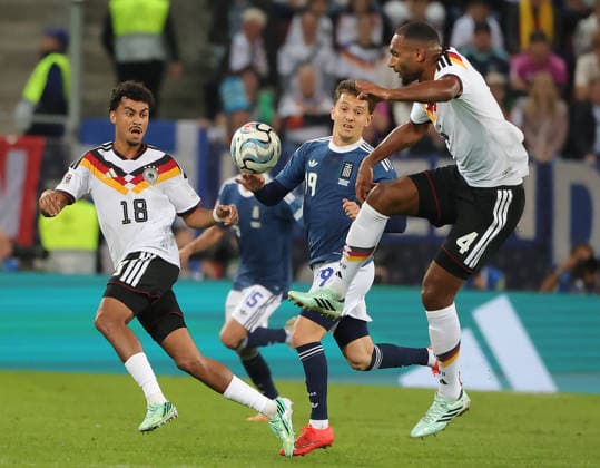 (260928) -- AUGSBURG, Sept. 28, 2026 -- Jonathan Tah (R), Nathaniel Brown (L) of Germany vie with Konstantinos Karetsas of Greece during the UEFA Nations League 2026 27 League A Group A match between Germany and Greece in Augsburg, Germany, Sept. 27, 2026. (Photo by Xinhua) (SP)GERMANY-AUGSBURG-UEFA NATIONS LEAGUE-LEAGUE A-GERMANY VS GREECE PhilippexRuiz 