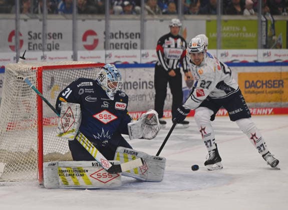 From left: Goalie Marvin Berbner, 31, of Dresden makes a save against Thomas Reichel of Ravensburg; Dresden Eislöwen vs. Ravensburg Towerstars; ice hockey; Dresden; Eislöwen; DEL2; DEL 2; 2nd Division; 2026–2027 season; JOYNEXT Arena ice rink in Ostragehege, September 27, 2026,