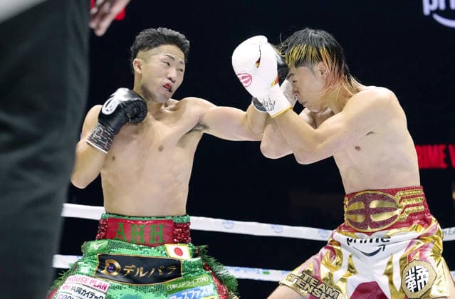 Boxing: Inoue vs. Nasukawa Takuma Inoue (L) of Japan throws a punch at compatriot ex-kickboxer Tenshin Nasukawa in the third round of their WBC bantamweight world title match at Toyota Arena Tokyo on Sept. 27, 2026. Inoue defended his title by unanimous decision.  A14AA0005629072P