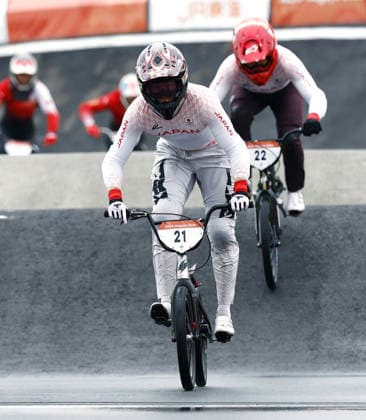 Aichi-Nagoya Asian Games: Cycling BMX racing Japan s Asuma Nakai (front) crosses the finish line to win the Aichi-Nagoya Asian Games men s BMX racing at Nagoya Velodrome BMX Race Course in Nagoya, central Japan, on Sept. 28, 2026.  A14AA0005629121P