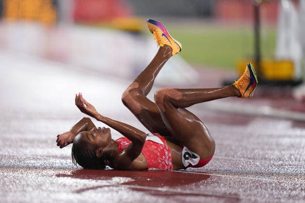 (260928) -- NAGOYA, Sept. 28, 2026 -- Winfred Yavi of Bahrain reacts after the women s 5000m final match of Athletics at the 20th Asian Games Aichi-Nagoya 2026 in Nagoya, Japan, Sept. 28, 2026. ) (SP)JAPAN-NAGOYA-ASIAN GAMES-ATHLETICS-WOMEN S 5000M LuixSiuxWai 