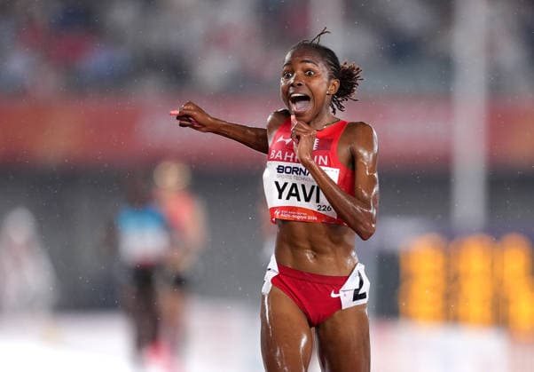 (260928) -- NAGOYA, Sept. 28, 2026 -- Winfred Yavi of Bahrain reacts after the women s 5000m final match of Athletics at the 20th Asian Games Aichi-Nagoya 2026 in Nagoya, Japan, Sept. 28, 2026. ) (SP)JAPAN-NAGOYA-ASIAN GAMES-ATHLETICS-WOMEN S 5000M LuixSiuxWai 