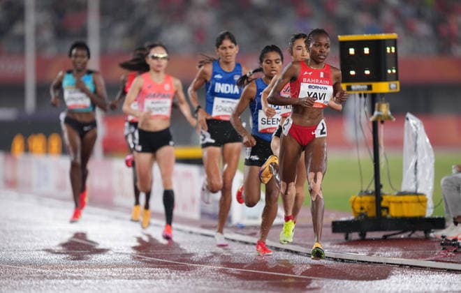 (260928) -- NAGOYA, Sept. 28, 2026 -- Winfred Yavi (1st R) of Bahrain competes during the women s 5000m final match of Athletics at the 20th Asian Games Aichi-Nagoya 2026 in Nagoya, Japan, Sept. 28, 2026. ) (SP)JAPAN-NAGOYA-ASIAN GAMES-ATHLETICS-WOMEN S 5000M LuixSiuxWai 