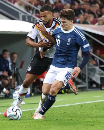 September 27, 2026, Germany, Augsburg: International soccer match between Germany and Greece; from left: Josha Vagnoman (GER) and Christos Tzolis (Greece)
