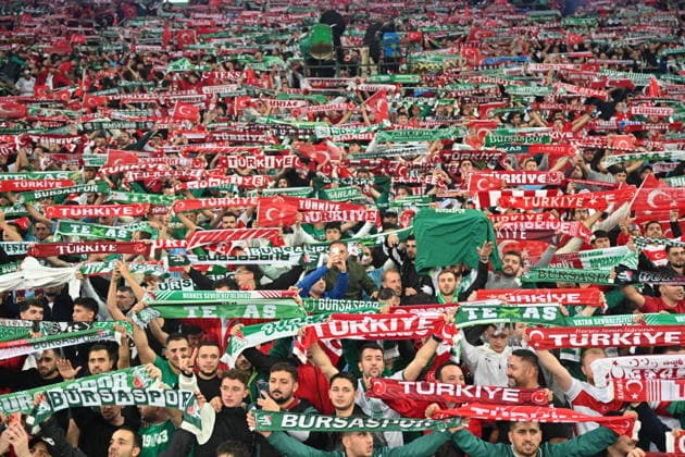 Turkiye v Italy - UEFA Nations League A BURSA, TURKIYE - SEPTEMBER 28: Fans of the Turkiye national football team wave scarves in the stands to show support during the UEFA Nations League A Group 1 match between Turkiye and Italy at Yuzuncu Yil Ataturk Stadium in Bursa, Turkiye on September 28, 2026. Serhat Cagdas Anadolu Bursa Turkey. Editorial use only. Please get in touch for any other usage.  Copyright: x2026xAnadoluxSerhatxCagdasx