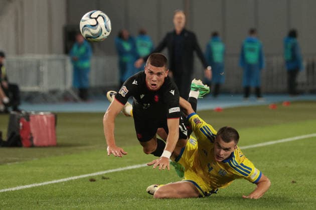 Giorgi Kvernadze of Georgia challenges Taras Mykhavko of Ukraine for the ball during the UEFA Nations League match between Georgia and Ukraine at the The Boris Paitchadze Dinamo Arena in Tbilisi, Georgia, on September 28, 2026. Tbilisi Dinamo Arena named after Boris Paichadze, Akaki Tsereteli Avenue, Didube, Tbilisi, 0154, Georgia Georgia Copyright: xArturxStabulnieksx 1J7A4100