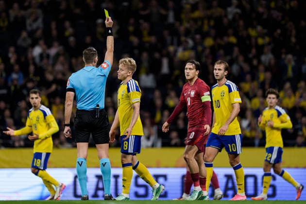 September 28, 2026: Referee Javier Alberola Rojas shows a yellow card to Daniel Svensson of Sweden during the Nations League soccer match between Sweden and Poland on September 28, 2026 in Stockholm. Photo by Joel Marklund. BILDBYRAN code JM JM0857 bbeng soccer football soccer international match Nations League UEFA Nations League Sweden Sweden A Poland  Copyright: JOELxMARKLUND BB260928JM022