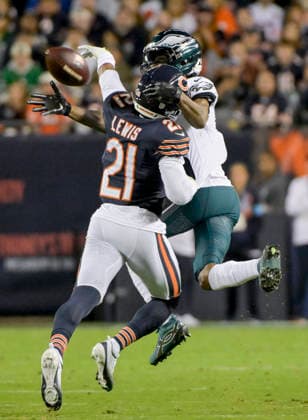 Chicago Bears cornerback Cam Lewis (21) is called for pass interference against Philadelphia Eagles wide receiver DeVonta Smith (6) during a game at Soldier Field in Chicago on Monday, September 28, 2026. Bears defeated the Eagles 27-7.  CHI20260928129 MARKxBLACK