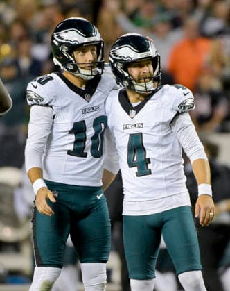 Philadelphia Eagles punter Braden Mann (10) and kicker Jake Elliott (4) celebrate making the extra point after the Eagles only touchdown of the game against the Chicago Bears during a game at Soldier Field in Chicago on Monday, September 28, 2026. Bears defeated the Eagles 27-7.  CHI20260928137 MARKxBLACK