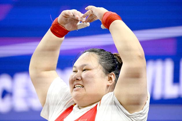 (260929) -- NAGOYA, Sept. 29, 2026 -- Li Wenwen of China reacts after the women s +86kg final of weightlifting at the 20th Asian Games Aichi-Nagoya 2026 in Nagoya, Japan, Sept. 29, 2026. ) (SP)JAPAN-NAGOYA-ASIAN GAMES-WEIGHTLIFTING-WOMEN S +86KG-FINAL YuxYang 