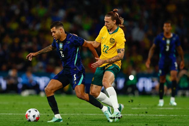 SOCCER AUSTRALIA BRAZIL, Bruno Guimaraes of Brazil and Jackson Irvine of Australia compete for the ball during the Queensland Football Series International Friendly, Länderspiel, Nationalmannschaft match between the Socceroos and Brazil at Suncorp Stadium in Brisbane, Tuesday, September 29, 2026. ( NO ARCHIVING, EDITORIAL USE ONLY  Copyright: xRUSSELLxFREEMANx 20260929166838316067