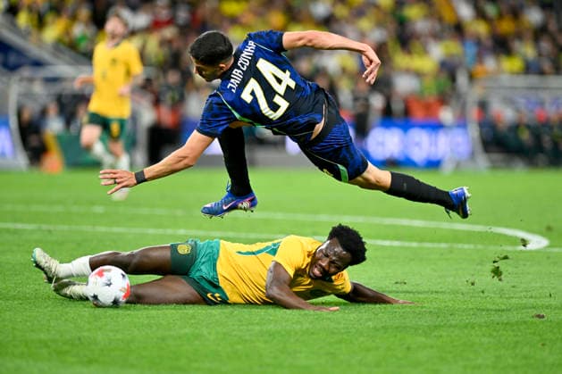 29th September 2026; Suncorp Stadium, Brisbane, Australia; Friendlies Football, Australia versus Brazil; Nestory Irankunda of Australia slides in for the ball as Jair Cunha of Brazil challenges NigelxOwen
