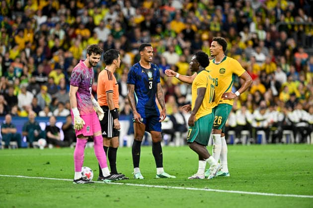 29th September 2026; Suncorp Stadium, Brisbane, Australia; Friendlies Football, Australia versus Brazil; Nestory Irankunda of Australia challenges a decision with the referee as Gabriel Magalhaes of Brazil looks on NigelxOwen