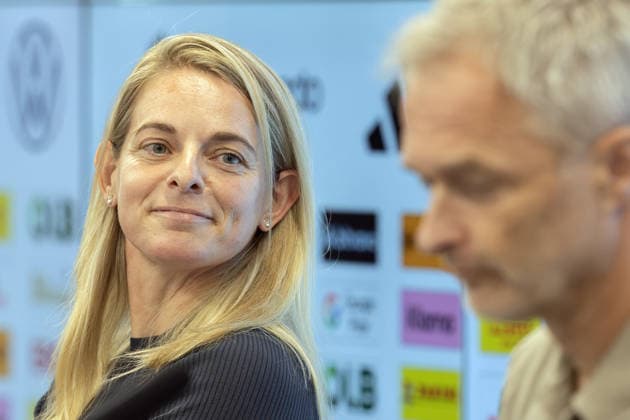 DFB Women s National Team Roster Announcement: DFB Sports Director Nia Künzer listens to remarks by National Team Coach Christian Wück during a press conference at the DFB Campus in Frankfurt am Main on September 29, 2026, Frankfurt am Main, Hesse, Germany, DFB Campus