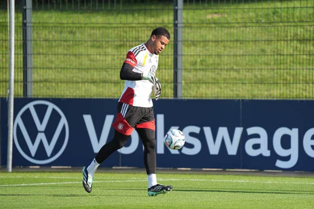 Goalkeeper Noah Atubolu (Germany) warms up with goalkeeper coach Stefan Wessels (Germany) at HerzoBase on September 29, 2026. German National Team Nations League preparation, Home Ground, HerzoBase, World of Adidas, Herzogenaurach