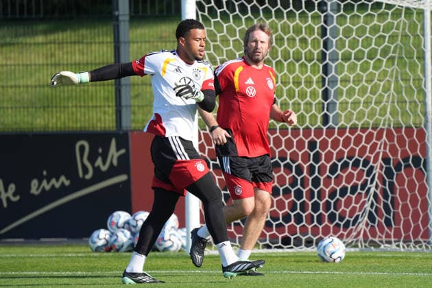 Goalkeeper Noah Atubolu (Germany) warms up with goalkeeper coach Stefan Wessels (Germany) at HerzoBase on September 29, 2026. German National Team Nations League preparation, Home Ground, HerzoBase, World of Adidas, Herzogenaurach