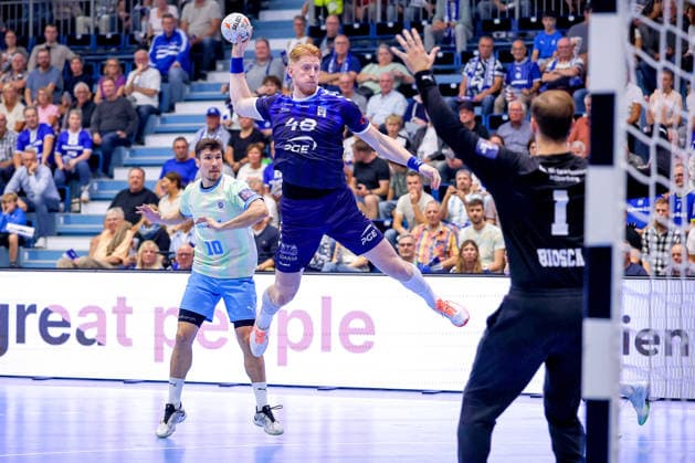 September 29, 2026, Handball, EL, VfL Gummersbach vs. PGE Wybrzeza Gdansk, Matchday 1 of the EHF European League, 2026–27 Men’s Season, Schwalbe Arena: Tomasz Gebala of PGE 48 shoots the ball at the goal defended by Ignacio Biosca of VfL Gummersbach 01, North Rhine-Westphalia, Germany
