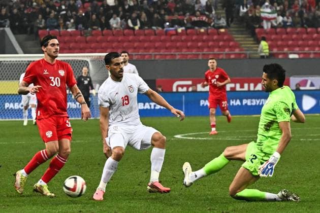 Russia Soccer Friendly Russia - Iran 9253986 29.09.2026 Russia s Ilya Vakhaniya, Iran s Ali Nemati and Iran s goalkeeper Hossein Hosseini in action during the friendly soccer match between Russia and Iran at Ak Bars Arena stadium, in Kazan, Republic of Tatarstan, Russia. Maksim Bogodvid Sputnik Kazan Republic of Tatarstan Russia  Copyright: xMaksimxBogodvidx