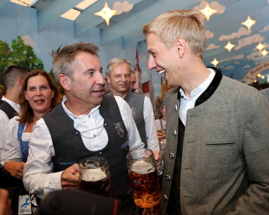 Soccer, Men s, Bavarian Regional League, 2026–2027 Season, TSV 1860 Munich, Official Oktoberfest Visit, Hacker Festzelt: Gernot Mang, President of TSV 1860 Munich (left), talking with Dominik Krause, Mayor of Munich (right), laughing while holding a Maß of beer