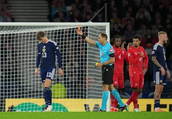Referee Nenad Minakovic shows a red card to Jack Hendry of Scotland after rescinding the yellow card he showed to Hendry earlier for a foul on Dan Ndoye of Switzerland. Scotland v Switzerland, Football, UEFA Nation s League, Group B1, Hampden Park, Glasgow, UK, Hampden Park, Glasgow, Scotland, Scotland, UK - 29 Sep 2026Glasgow Hampden Park Scotland United Kingdom Copyright: xStuartxWallace Shutterstockx 17176216az