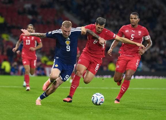 UK: UEFA Nations League, Scotland v Switzerland at Barclays Hampden, Glasgow, Scotland on 29 September 2026: Pictured: Oli McBurnie (Scotland) and Remo Freuler (Switzerland) Glasgow Barclays Hampden Scotland Copyright: xAlexxToddx